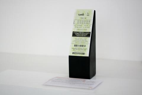 TicketOnWoodenPlinth